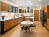 Designing a Kitchen That Stands Out with Light Finishes and Dark Focal Points Wood Tone Kitchen Cabinets