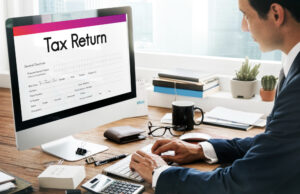 Tax lien property solutions in OK to fix tax debt problems in 2026 Computer screen showing a tax return, with a focus on tax lien solutions for resolving debt problems in Oklahoma, 2026.