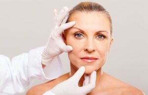 Skin Tightening Facial Near Tysons Corner VA Woman receiving a professional Skin Tightening Facial Near Tysons Corner VA with practitioner examining her face for anti-aging treatment.
