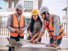 Construction Services in London: Building with Purpose and Precision Construction Team Reviewing Blueprints